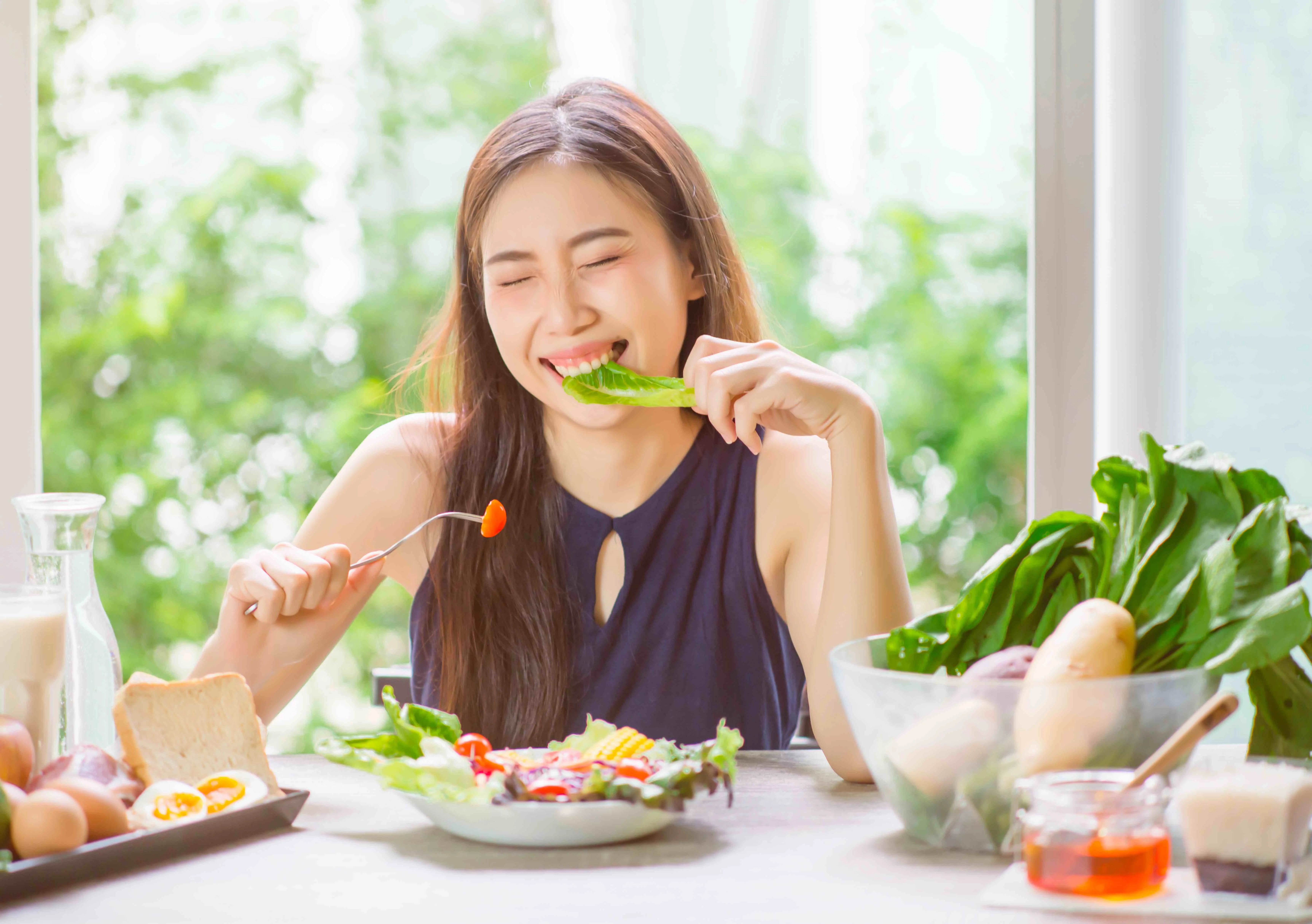 Young Woman Eating Food